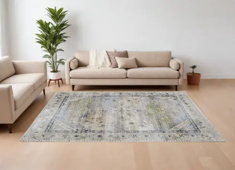 8' X 10' Ivory Green and Blue Abstract Power Loom Worn Faded Area Rug