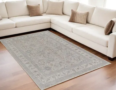 5' X 7' Silver Taupe and Blue Oriental Power Loom Worn Faded Area Rug With Fringe