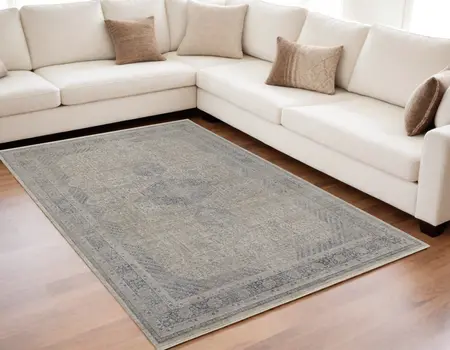 5' X 7' Gray Blue and Taupe Oriental Power Loom Worn Faded Area Rug With Fringe