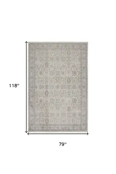 7' X 10' Gray and Ivory Oriental Power Loom Worn Faded Area Rug With Fringe