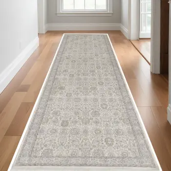 12' Gray and Ivory Oriental Power Loom Worn Faded Runner Rug With Fringe