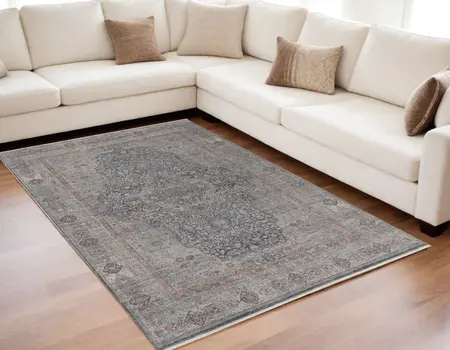5' X 7' Gray Blue and Red Oriental Power Loom Worn Faded Area Rug With Fringe