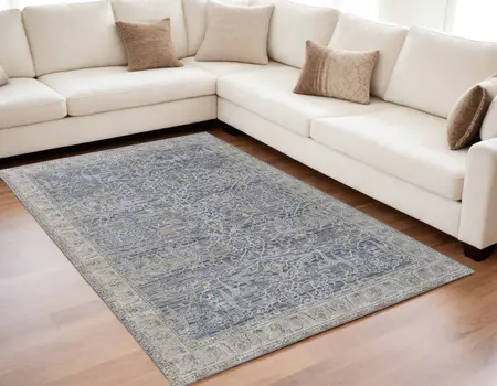 5' X 8' Taupe and Blue Ikat Power Loom Worn Faded Area Rug With Fringe