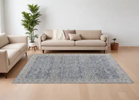 7' X 10' Taupe and Blue Ikat Power Loom Worn Faded Area Rug With Fringe