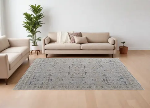 7' X 10' Gray Blue and Red Ikat Power Loom Worn Faded Area Rug With Fringe
