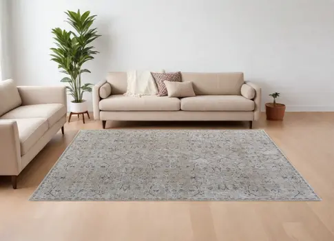 9' X 13' Ivory Taupe and Blue Abstract Power Loom Worn Faded Area Rug With Fringe