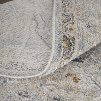 8' X 10' Ivory Tan and Blue Abstract Power Loom Worn Faded Area Rug With Fringe