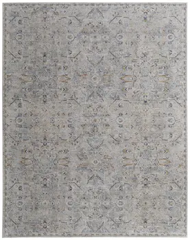 9' X 13' Ivory Tan and Blue Abstract Power Loom Worn Faded Area Rug With Fringe