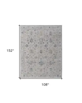 9' X 13' Ivory Taupe and Blue Floral Power Loom Worn Faded Area Rug With Fringe