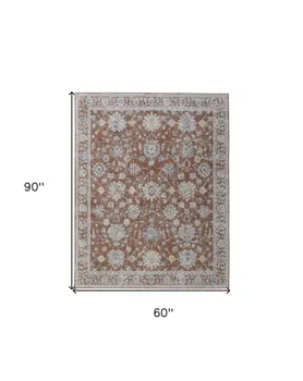 5' X 8' Red Blue and Ivory Floral Power Loom Worn Faded Area Rug With Fringe