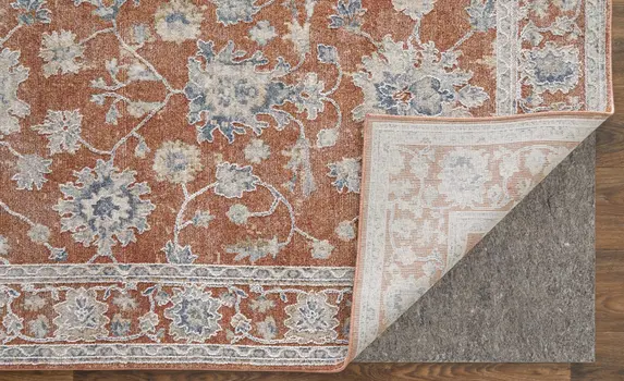 7' X 10' Red Blue and Ivory Floral Power Loom Worn Faded Area Rug With Fringe