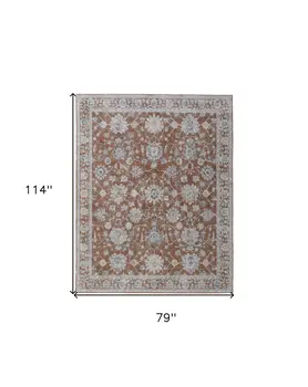 7' X 10' Red Blue and Ivory Floral Power Loom Worn Faded Area Rug With Fringe