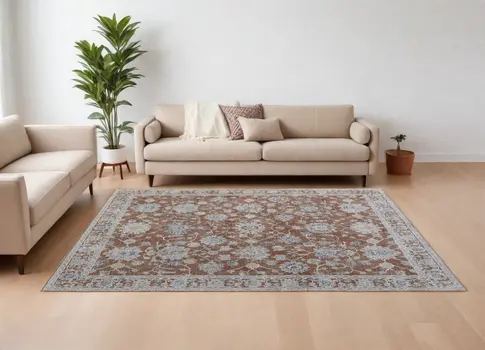 8' X 10' Red Blue and Ivory Floral Power Loom Worn Faded Area Rug With Fringe