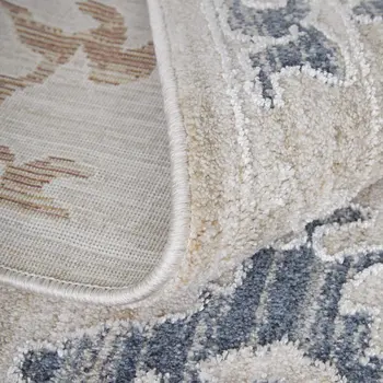 8' X 10' Ivory Blue and Gold Floral Power Loom Worn Faded Area Rug With Fringe