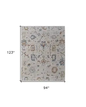 8' X 10' Ivory Blue and Gold Floral Power Loom Worn Faded Area Rug With Fringe