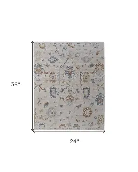 2' X 3' Ivory Blue and Gold Floral Power Loom Worn Faded Area Rug With Fringe