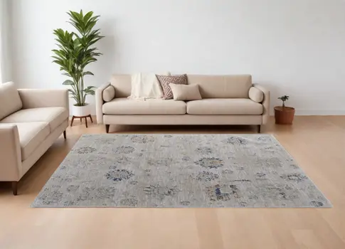8' X 10' Ivory Taupe and Blue Floral Power Loom Worn Faded Area Rug With Fringe