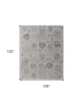 9' X 13' Ivory Taupe and Blue Floral Power Loom Worn Faded Area Rug With Fringe