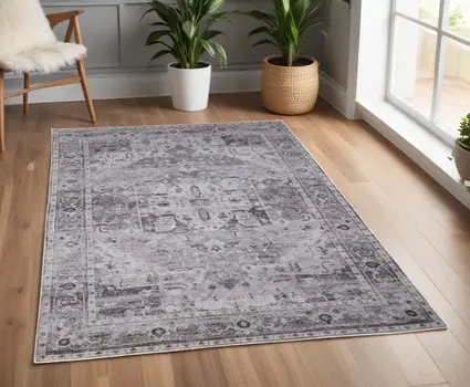 4' X 6' Gray and Ivory Oriental Power Loom Worn Faded Washable Area Rug
