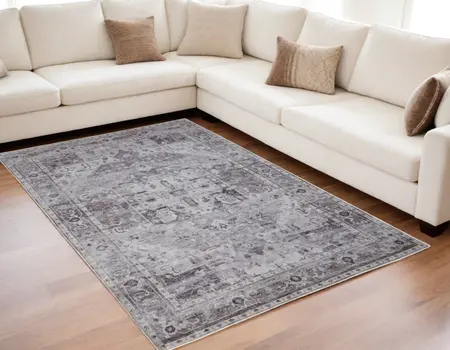 5' X 8' Gray and Ivory Oriental Power Loom Worn Faded Washable Area Rug