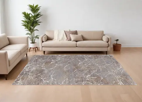 7' X 10' Ivory Brown and Taupe Abstract Power Loom Area Rug