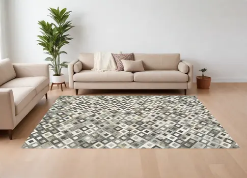 6' X 9' Black Gray and White Faux Cowhide Animal Print Power Loom Area Rug