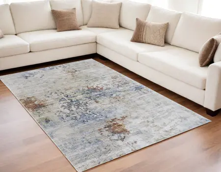 5' X 8' Red Blue and Ivory Abstract Power Loom Area Rug