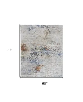 5' X 8' Red Blue and Ivory Abstract Power Loom Area Rug