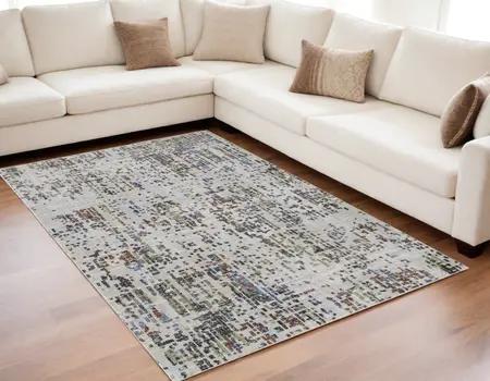 5' X 8' Ivory Green and Blue Abstract Power Loom Area Rug
