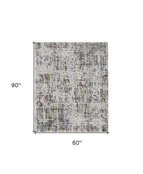 5' X 8' Ivory Green and Blue Abstract Power Loom Area Rug
