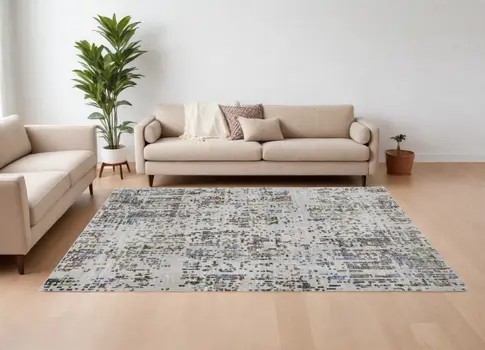 8' X 10' Ivory Green and Blue Abstract Power Loom Area Rug