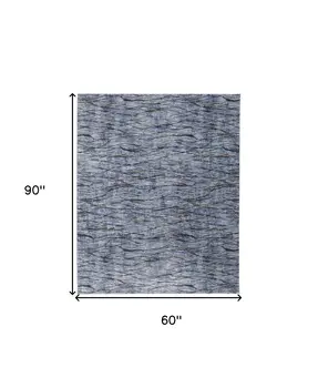 5' X 8' Blue Ivory and Tan Abstract Power Loom Area Rug