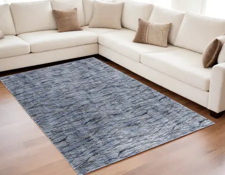 5' X 8' Blue Ivory and Tan Abstract Power Loom Area Rug