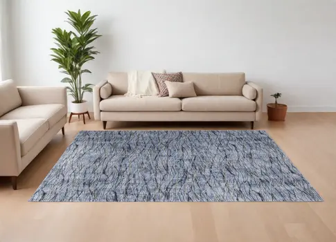 7' X 10' Blue Ivory and Tan Abstract Power Loom Area Rug