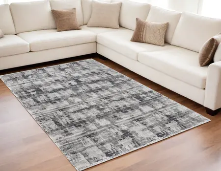5' X 8' Gray and Ivory Abstract Power Loom Area Rug