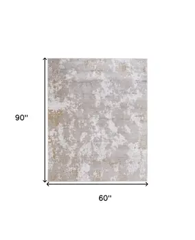 5' X 8' Gray Brown and Ivory Abstract Power Loom Area Rug