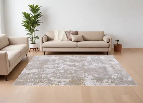 7' X 10' Gray Brown and Ivory Abstract Power Loom Area Rug