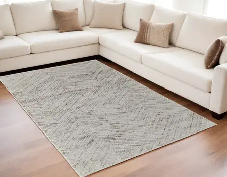 5' X 8' Ivory and Brown Geometric Power Loom Area Rug