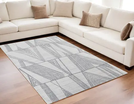 5' X 8' Black and Ivory Abstract Hand Woven Area Rug