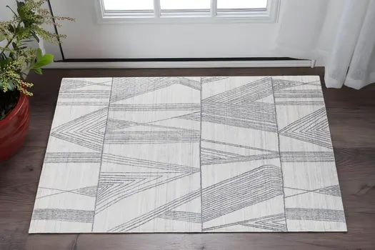 2' X 3' Black and Ivory Abstract Hand Woven Area Rug