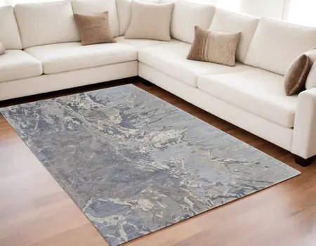 5' X 8' Ivory Taupe and Green Abstract Hand Tufted Worn Faded Area Rug