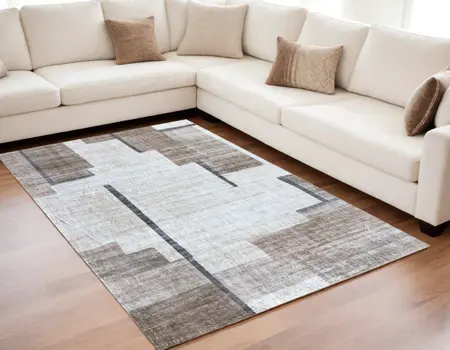 5' X 8' Beige and Brown Abstract Area Rug