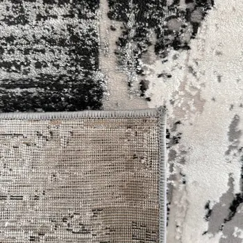 4' X 6' Black Gray and Beige Abstract Area Rug