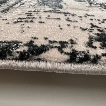 4' X 6' Black Gray and Beige Abstract Area Rug