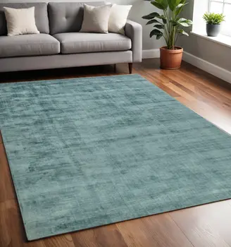 5' X 8' Sea Green And Light Blue Abstract Hand Woven Area Rug