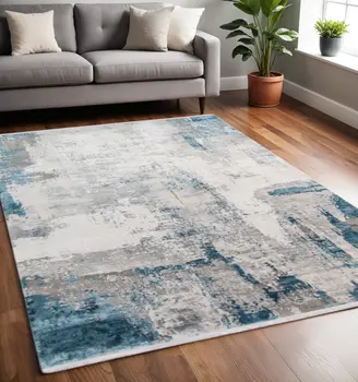 5' X 8' Gray Blue And Ivory Abstract Area Rug With Fringe