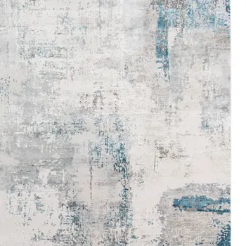 5' X 8' Gray Blue And Ivory Abstract Area Rug With Fringe