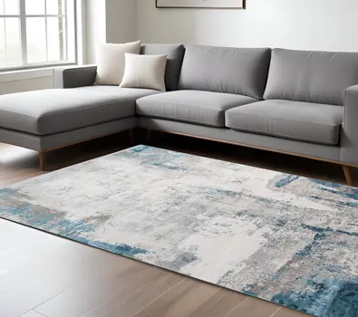 8' X 10' Gray Blue And Ivory Abstract Area Rug With Fringe