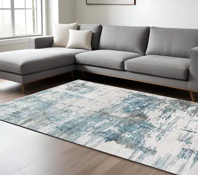 5' X 8' Ivory Blue And Brown Abstract Area Rug With Fringe