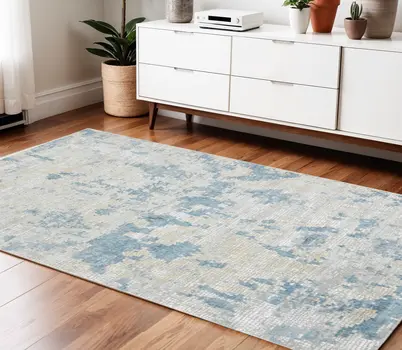 4' X 6' Ivory And Sky Blue Abstract Area Rug